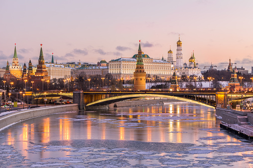 Magnificent stone paved Red Square in Moscow, Russia, orthodox church of St. Basil and the Kremlin on a cloudy autumn day