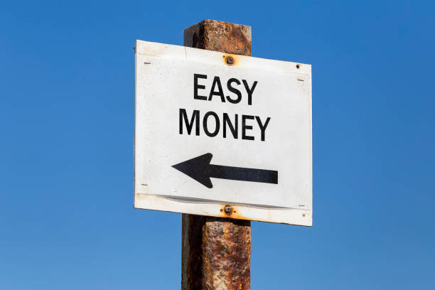 istock Easy money and arrow signpost 831765022
