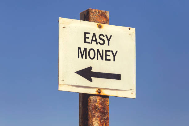 istock Easy money and arrow signpost 2 831768208