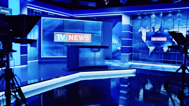 CS TV news intro displaying on the screen in an empty news studio