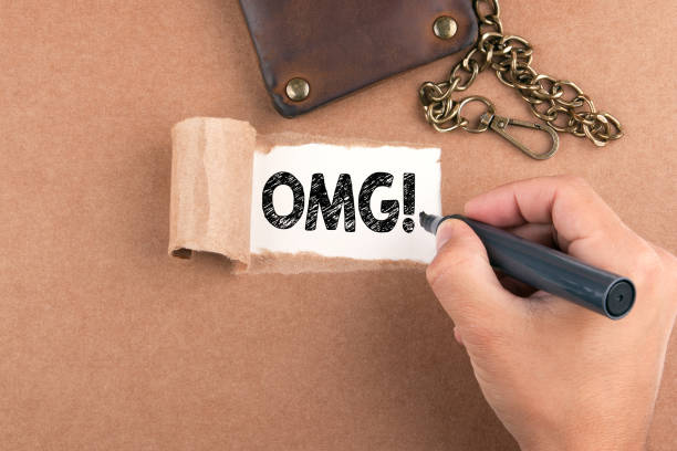 istock OMG! Inscription in window of torn paper 831797318
