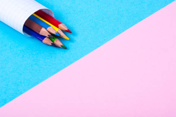 istock Colored pencils on bright pastel paper 831801462
