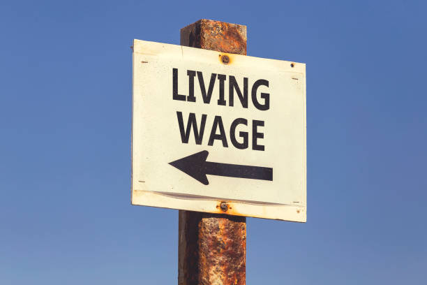 istock Living wage word and arrow signpost 2 831803072