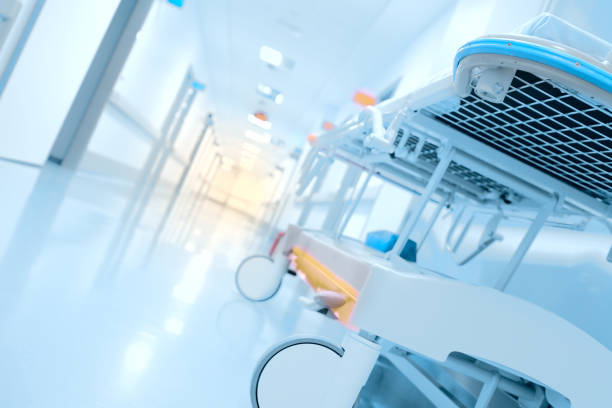 istock Gurney in a long corridor illuminated by a flash of light 831809188