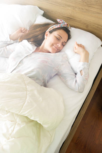 istock Woman sleeping at home 831809628