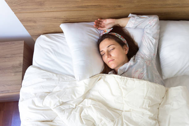 istock Woman sleeping at home 831811950