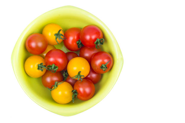 Yellow and red ripe small tomatoes. Studio Photo