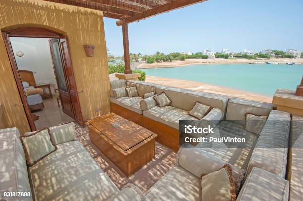 Terrace Balcony With Chairs In Tropical Luxury Apartment Stock Photo - Download Image Now