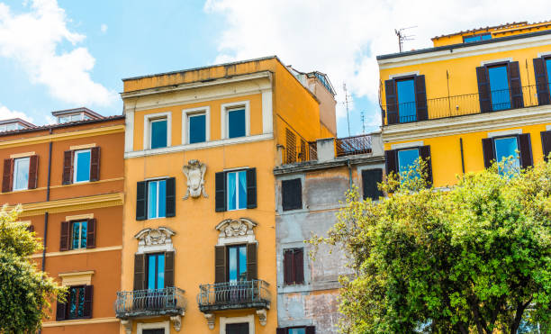 istock orange and yellow houses in a row 831821308