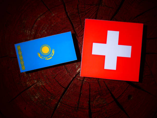 istock Kazakhstan flag with Swiss flag on a tree stump isolated 831822232