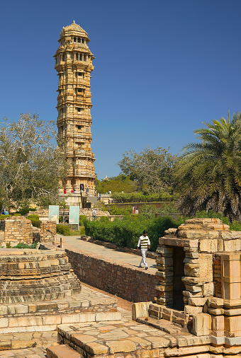 Chittorgarh, India - January 31, 2014: Indian tourists at Chittogarh fort, World Heritage Site, next to the Victory Tower ( Vijay Stambh), Chittorgarh, Rajasthan, India