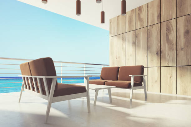 istock Wooden balcony, brown armchairs, side 831825428