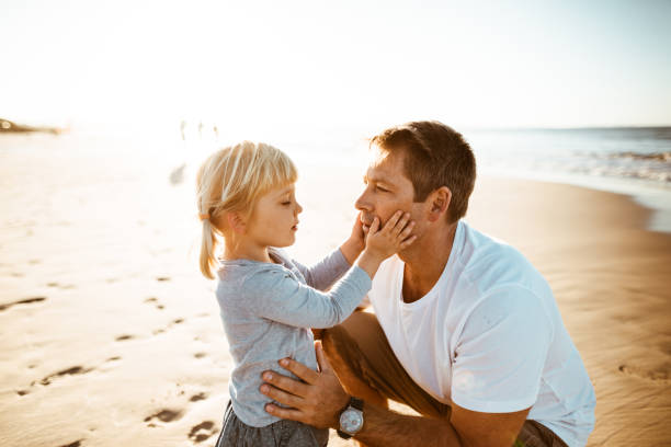 istock lovely daughter kiss the dad 831825792