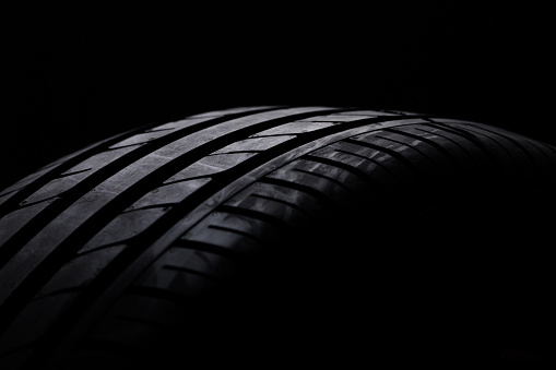 brand new tyres against black background