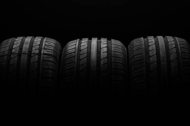 istock Studio shot of a black car tires 831832194