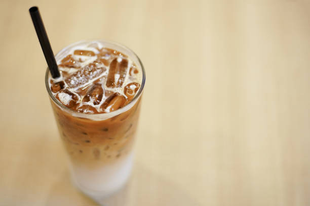 istock Ice coffee on the wood table. 831839446