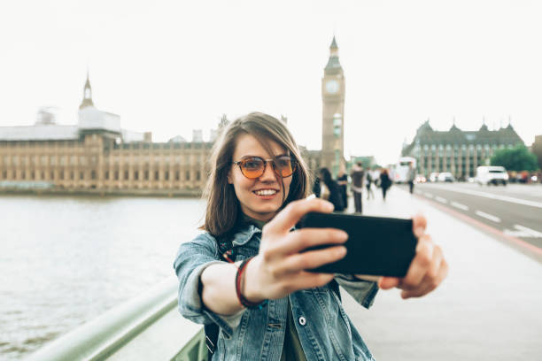 istock Cheerful tourist taking selfie 831843730