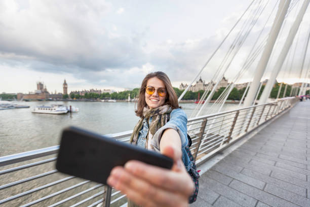 istock Cheerful tourist taking selfie 831843732