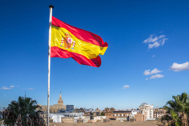 istock Spanish flag flies over Seville skyline including Cathedral 831844158
