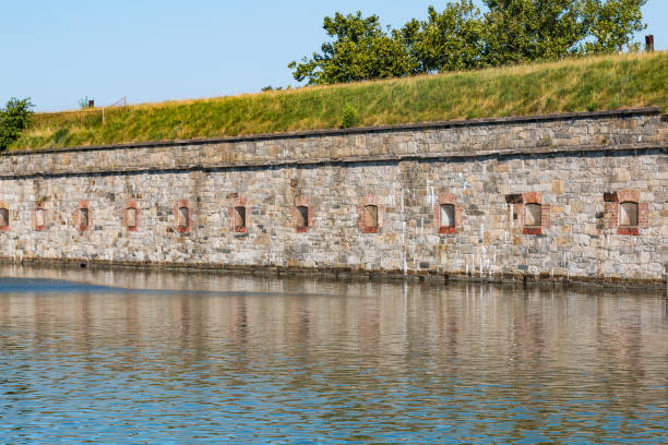 Fortress Walls at Fort Monroe in Hampton, Virginia Hampton, Virginia - July 9, 2017:  Fortress walls at Fort Monroe surrounded by a moat.  Construction began on Fort Monroe in 1819 as part of a coastal defense strategy developed by the U.S. Army. hampton virginia photos stock pictures, royalty-free photos & images