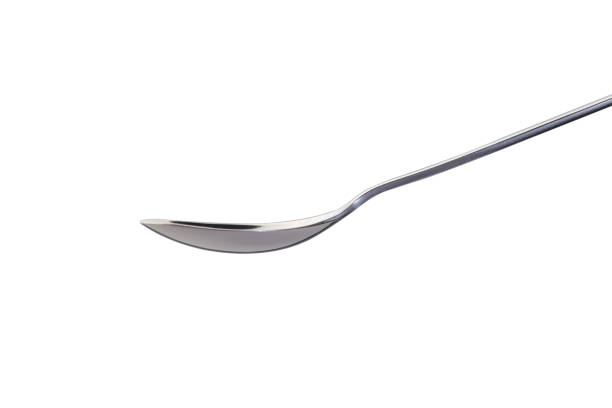 An empty spoon on a white background stock photo