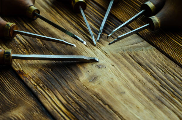 istock Different gravers for jewelry on wooden background 831873106