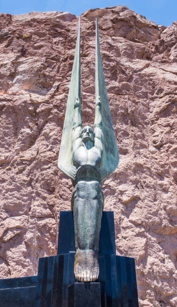 Monument in honor of workers and builders of the Hoover Dam Boulder City, Nevada, USA - June 19, 2017: Monument in honor of workers and builders of the Hoover Dam in Nevada and Arizona. US Tourist Attraction - The Hoover Dam Hydropower Station on the Colorado River hoover dam statues stock pictures, royalty-free photos & images