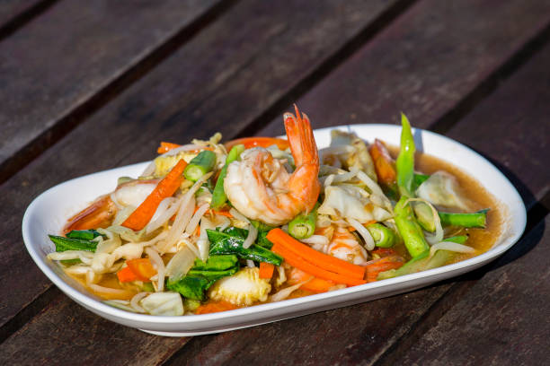 istock Thai food, seafood with vegetable spicy salad 831881284