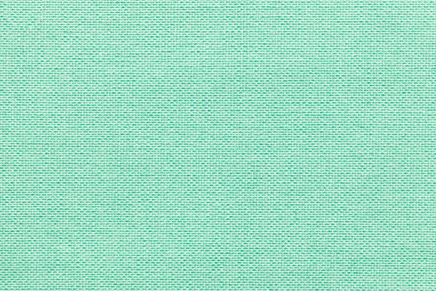 fondo verde claro de un material textil con el patrón de mimbre, closeup. - cotton smooth green plant fotografías e imágenes de stock