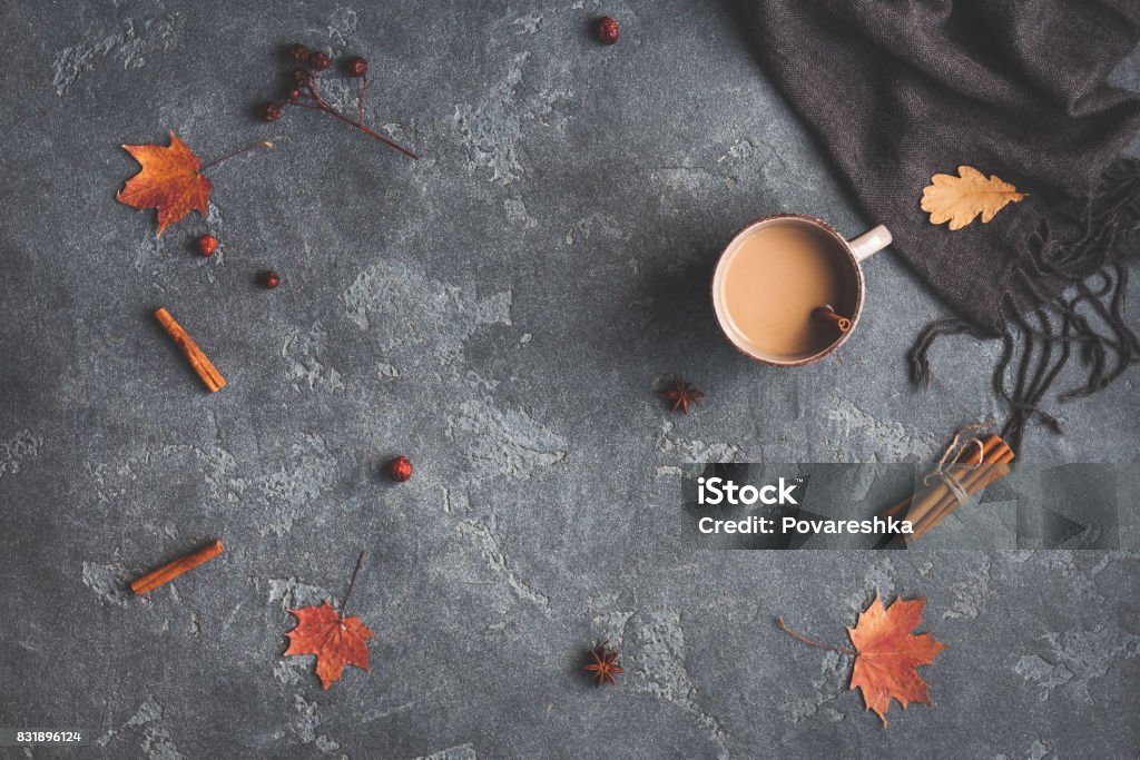 Cup of coffee, blanket, autumn leaves. Flat lay, top view Autumn composition. Cup of coffee, blanket, autumn leaves on black background. Flat lay, top view Autumn Stock Photo