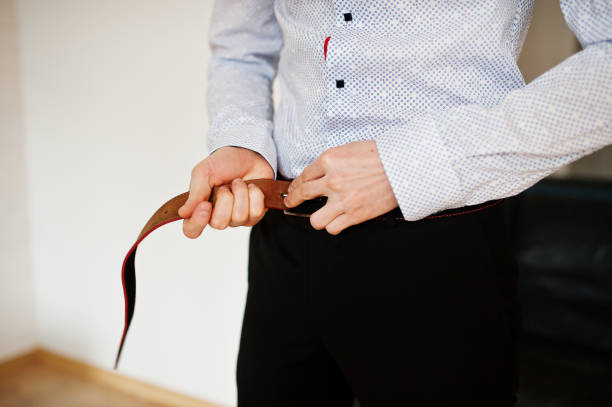 istock Portrait of a handsome groom dressing up and getting ready for his wedding. 831896540