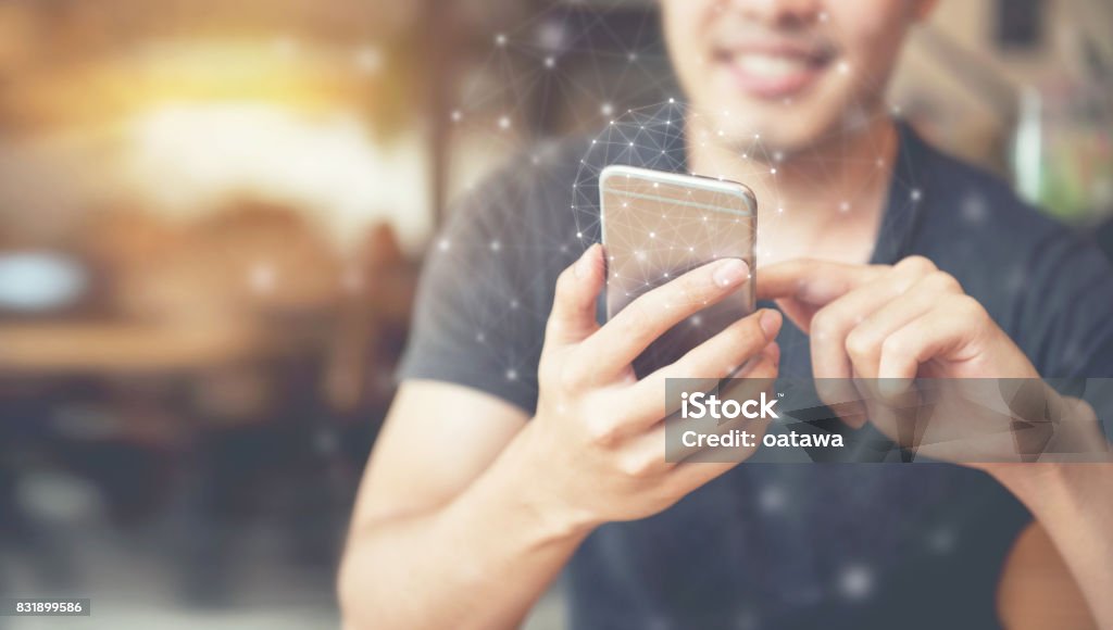 Man hand using mobile phone, Worldwide connection technology interface. Electronic Banking Stock Photo