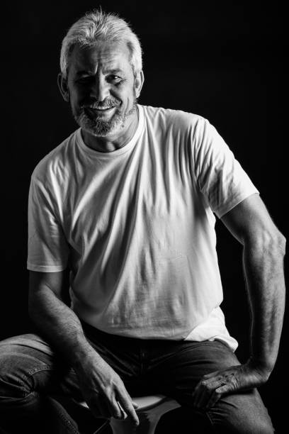 istock Mature man with white hair and beard smiling 831900526
