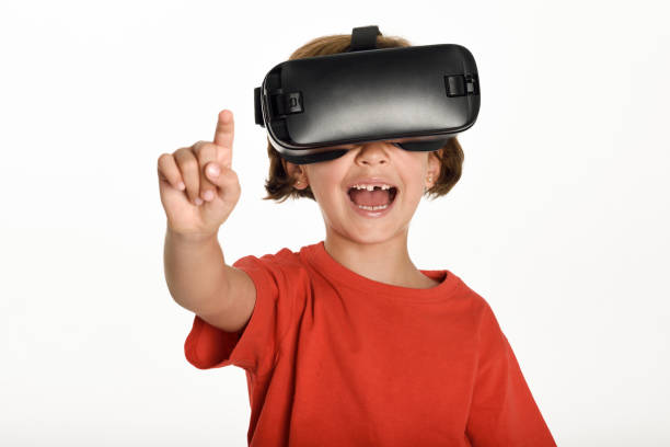 istock Little girl looking in VR glasses and gesturing with his hands. 831911290