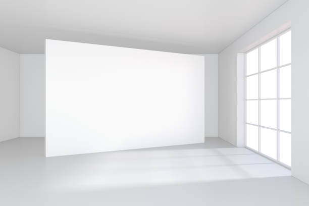 istock White billboard in an empty office with large windows and beautiful diffused light from the window. 3D rendering 831917944