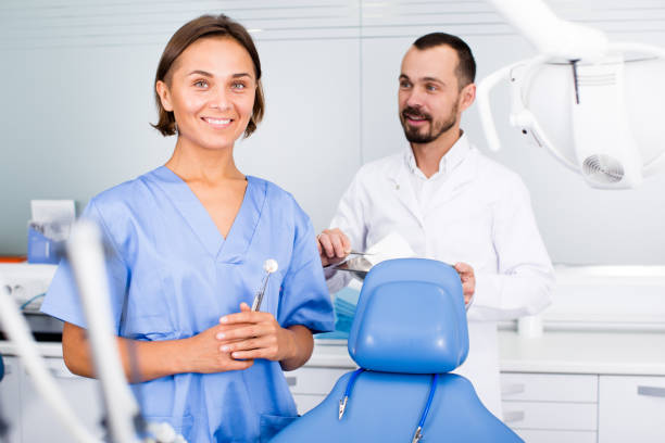 istock Portrait of dentist and assistant 831918848