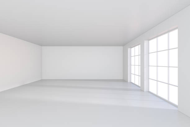 istock large office with windows and falling light from the window to the floor. 3D rendering 831924236
