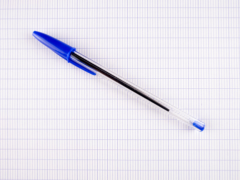 Blue ballpoint pen on a large checkered sheet