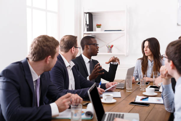 istock Business meeting. Young team in modern office 831963594
