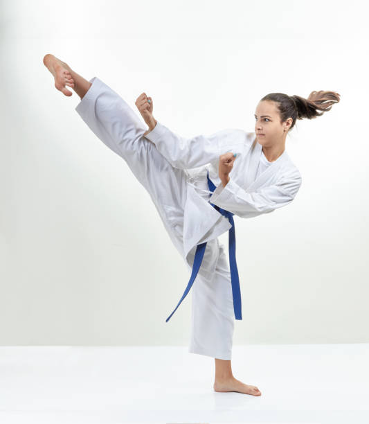 istock Girl athlete is training kick leg 831969160