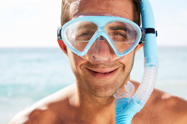 istock Smiling dude in leaking scuba mask 831969842
