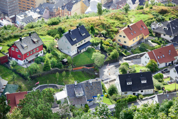 Idyllic view of villas, from top of Mount Fløyen. Bergen city Bergen, Norway - August 9, 2017: Idyllic view of villas, from top of Mount Fløyen. Bergen city in background. fløyen stock pictures, royalty-free photos & images