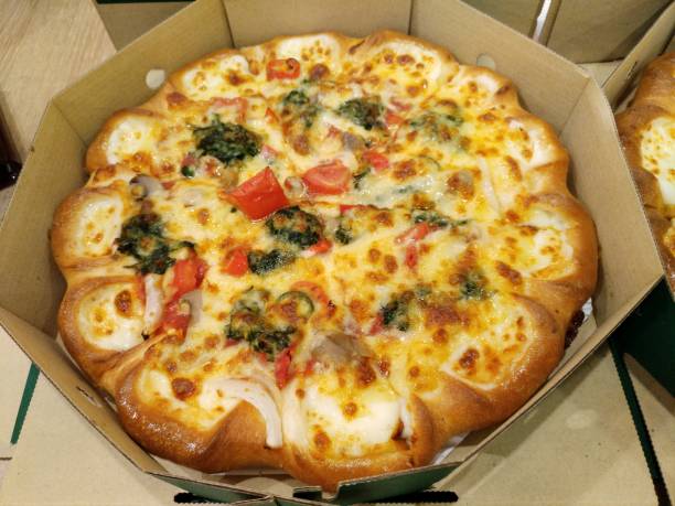 Vegetarian (Veggie) Pizza, Cheese Crust with box Whole-pan Vegetarian or Veggie Pizza stuffed with cheese at the crust stuffed crust pizza stock pictures, royalty-free photos & images