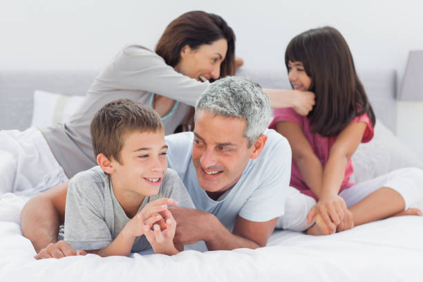 istock Family together on bed 831978046