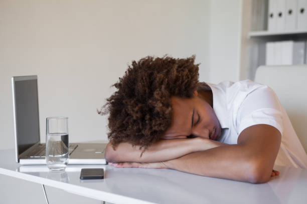 istock Casual businessman sleeping at his desk 831978070