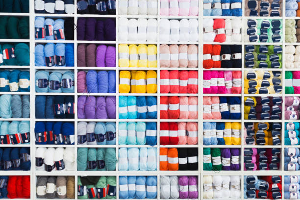 istock Shelves with colorful wool and yarn 831978452