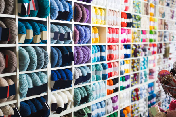istock Shelves with various knitting yarn is staying 831978600