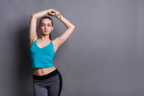 istock Fitness model woman warm up at studio background 831985014