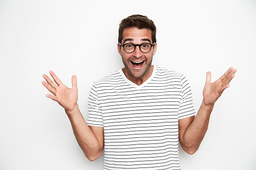 Ecstatic guy in glasses and t-shirt, portrait