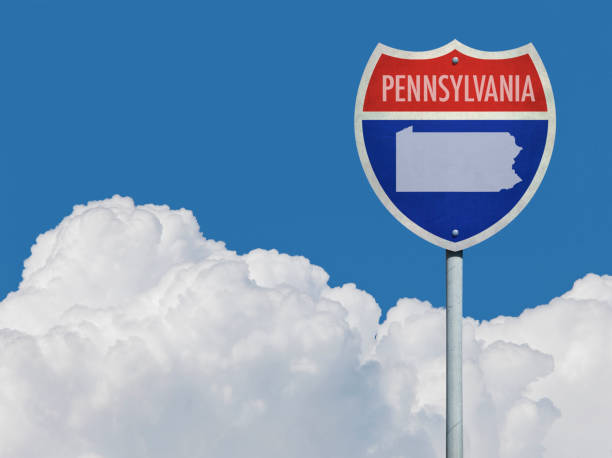 istock Highway sign for Interstate road in Pennsylvania with map in front of clouds 831993526